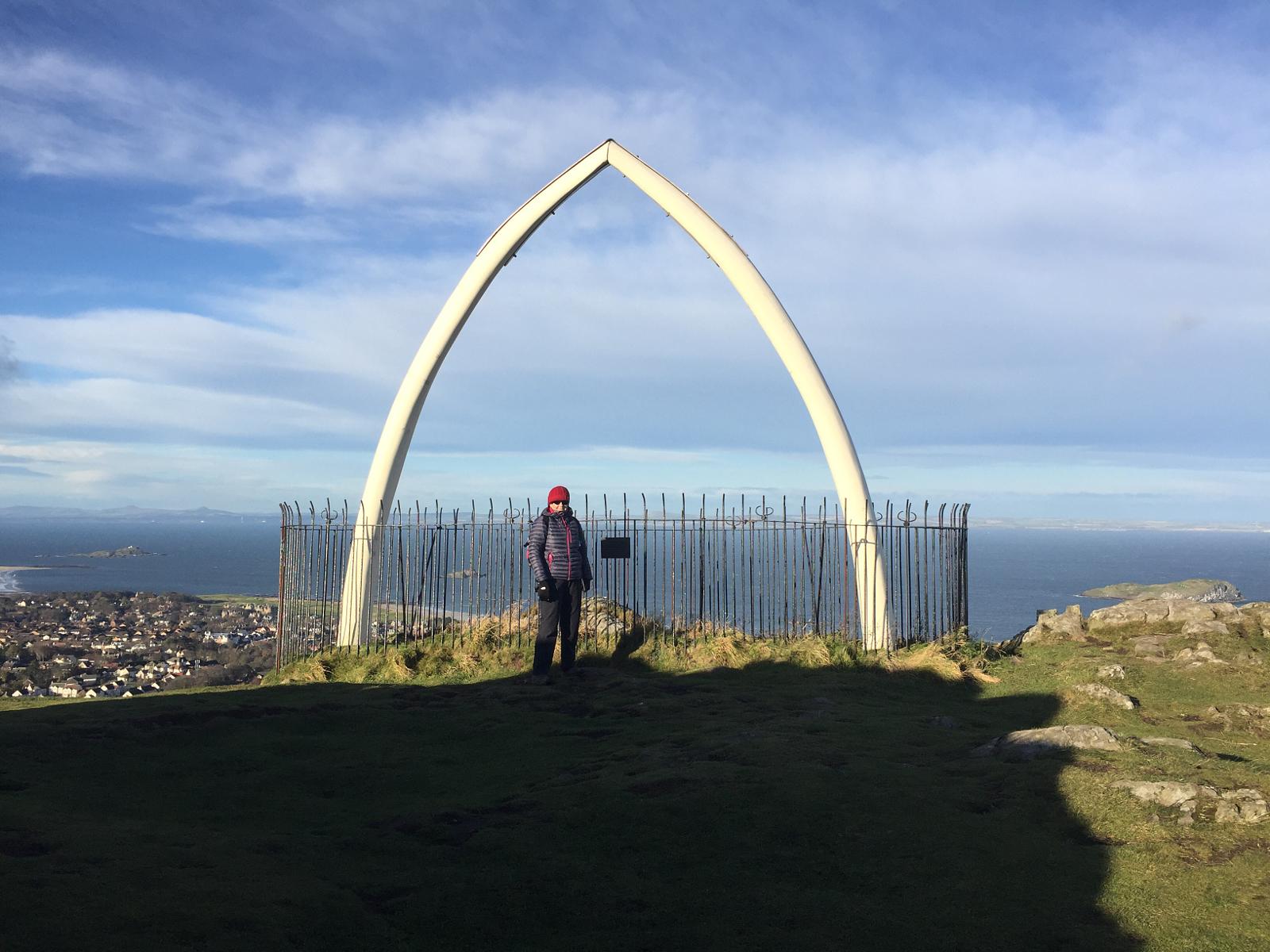 Next to the whale's jawbone a the top of North Berwick Law